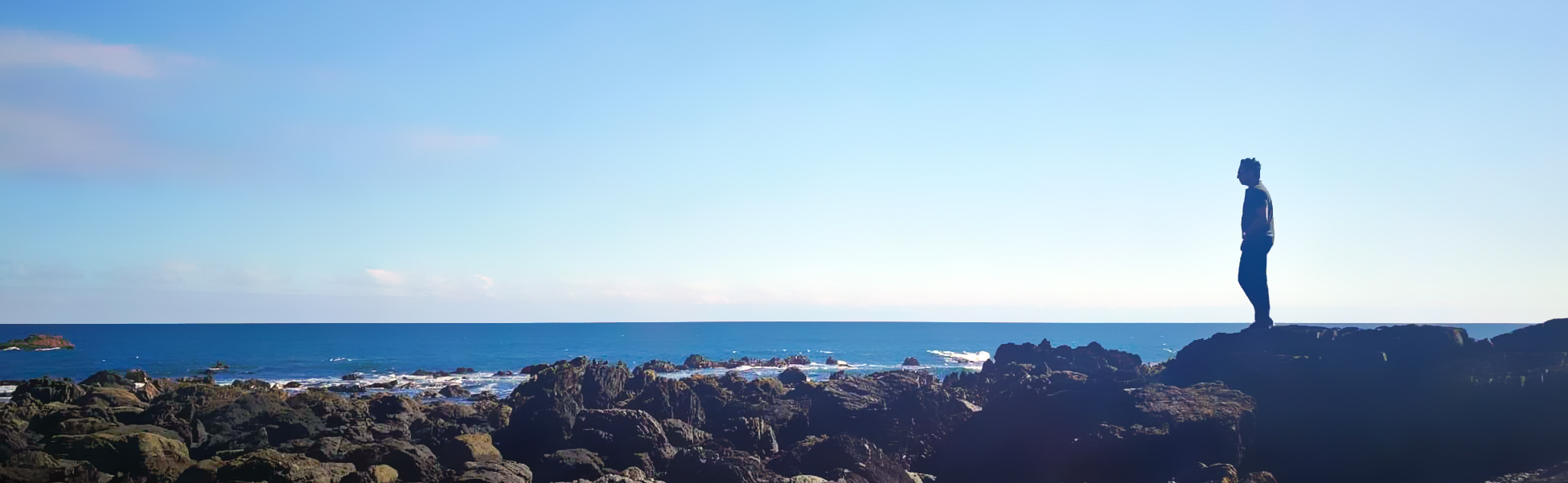 Kinkar Saha overlooking rock pools in New Zealand